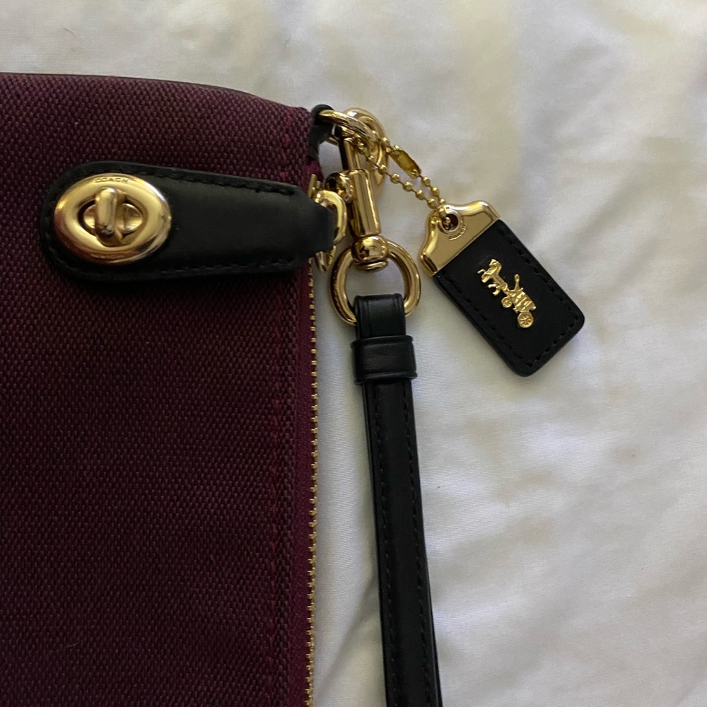 Coach Burgundy Canvas Wristlet with Black Strap and Gold Hardware Accent